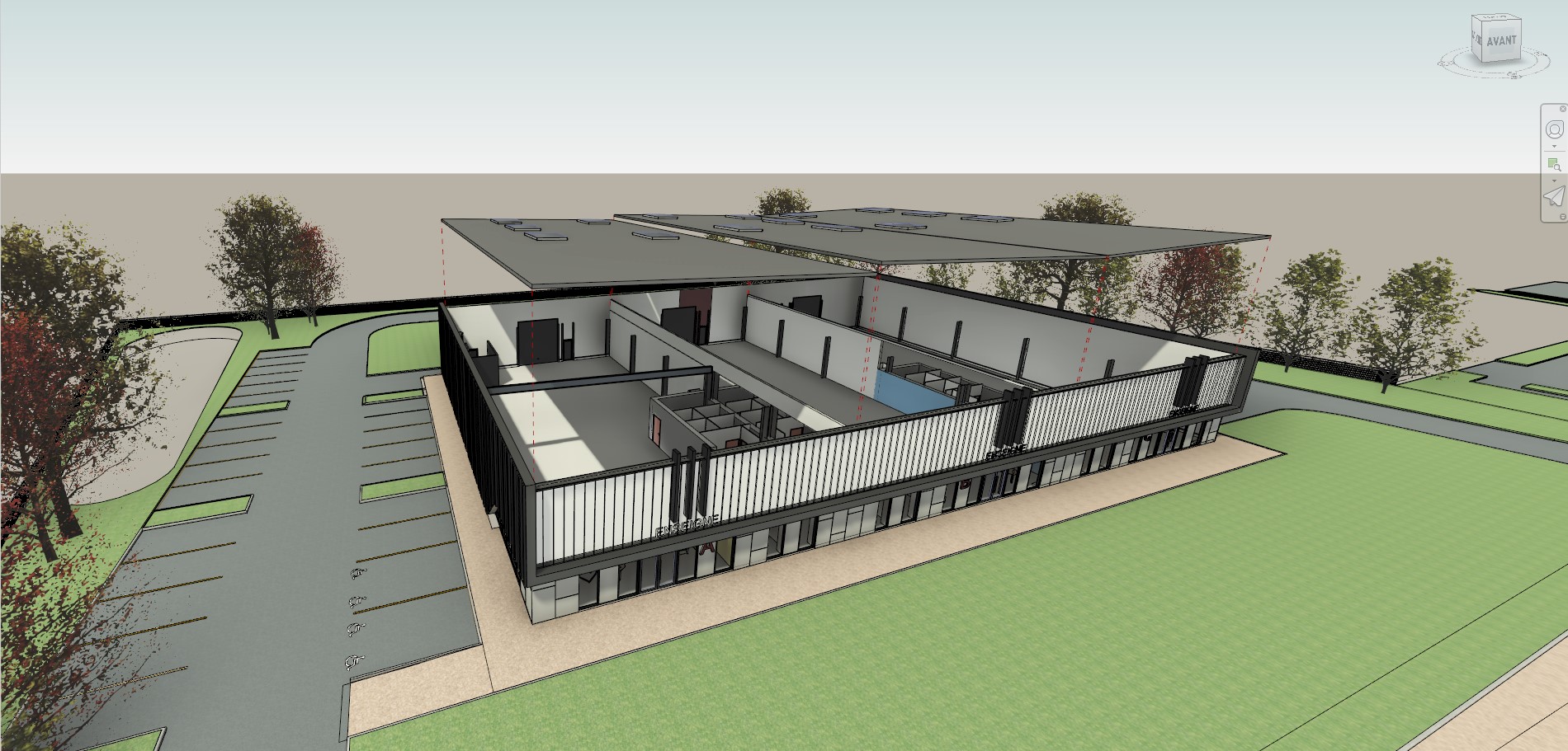 Revit_Plan 3D d’un bâtiment éducatif moderne en construction Vue 3D d’un bâtiment moderne en construction avec une structure ouverte et des espaces intérieurs clairement visibles, entouré d’un parking et d’espaces verts.